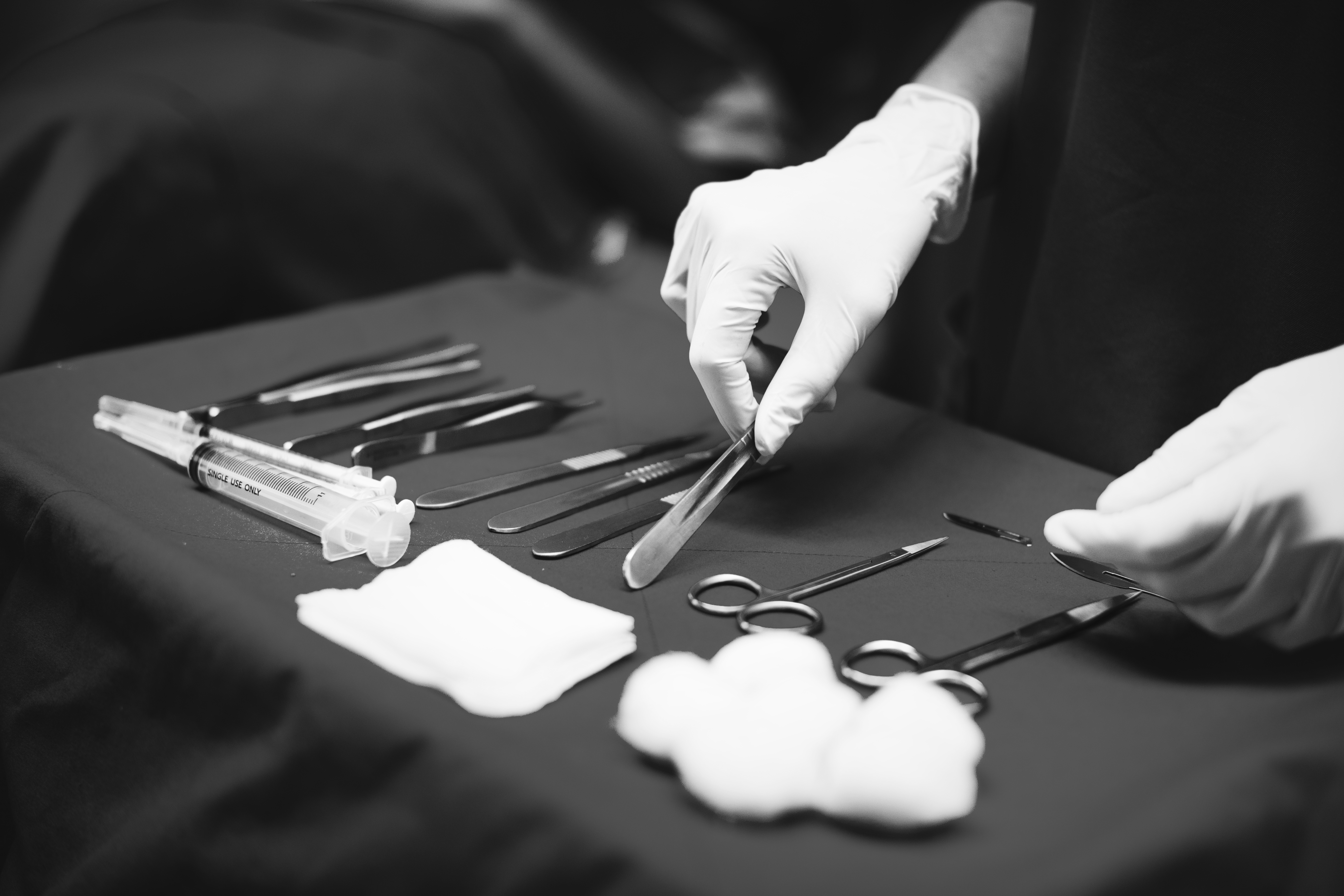 Doctor preparing medical tools for operation